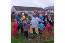 Greener Peebles' Grow Kids group with one of their new scarecrows