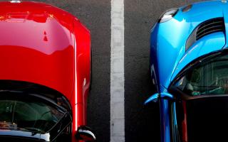 Stock image of cars parked. Photo: Unsplash/Possessed Photography
