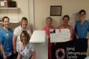 Kim Dawson, Lesley Wilson, Susan Greenhalgh, Annette Holton, Sheila Hardie and  Joanne Aitchison with the bone density scanner at Borders General Hospital