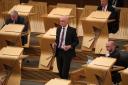 Deputy First Minister John Swinney in the Scottish Parliament. Photo: Andrew Milligan/PA Wire