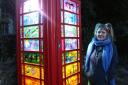 The community in Traquair adopted the 1930s phonebox last year, and have now restored it with 'stained glass' panels created by a local artist. Photo: Helen Barrington