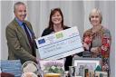 Fallago Environment Fund Chairman, Gareth Baird presents Suzy Finlayson and Kirsty Robb from the Roxburghshire Federation of Scottish Women’s Institutes with a cheque for £2,000.