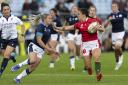Wales Ffion Lewis holds off Scotland's Chloe Rollie during the Women's Rugby World Cup group stage match at the Semenoff Stadium, Whangarei. Picture date: Sunday October 9, 2022. Photo PA Wire Brett Phibbs