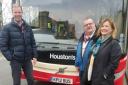 Mr Begg, Mr Small and Ms Thomson with one of the Houston's buses