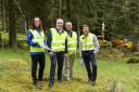Forest Holidays' Andrew Brook, minister Richard Lochhead, Elaine Jackson SOSE and Paul Andrews Garth, project manager for the Glentress Masterplan