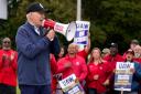 President Joe Biden joins striking United Auto Workers on the picket line (Evan Vucci/AP)