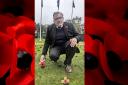 MP David Mundell lays a poppy cross tribute at the Garden of Remembrance