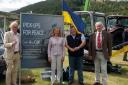 Pick-ups for Peace volunteers James Taylor, Karena Hanley, and Ed Strang Steel with charity foudner Keith Dawson at Peebles Show. Photo: Pick-ups for Peace