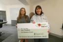 Isla Paterson receiving her grant from Shirley Marr, of Rowan Boland Memorial Trust