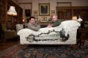 Paul Simmons of Timorous Beasties with the Duke of Buccleuch on the sofa depicting the  south façade of Bowhill House. Picture by Gareth Easton.