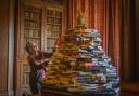 4th December 2021
Abbotsford House, the home of Sir Walter Scott.
Melrose, Scottish Borders.

Christmas stand alone

Claudia Bolling , from Abbotsford pictured putting the finishing touches to a Christmas Tree display made entirely of books by Sir