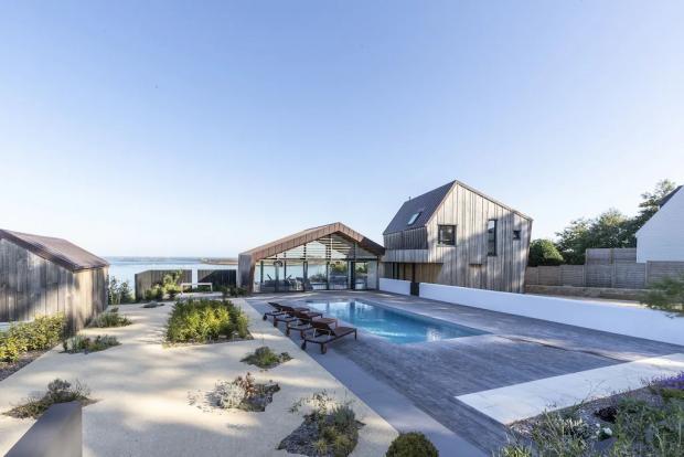 Peeblesshire News: Modern villa with stunning sea views, swimming pool, Jaccuzi - Brittany, France. Credit: Vrbo