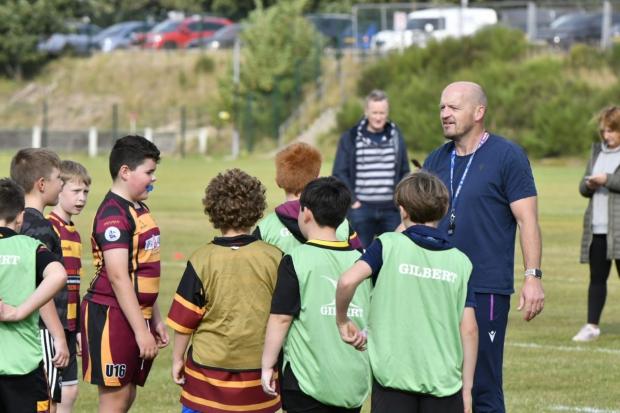 Peeblesshire News: Gregor Townsend coaching Ellon RFC youngsters Photo Scottish Rugby 