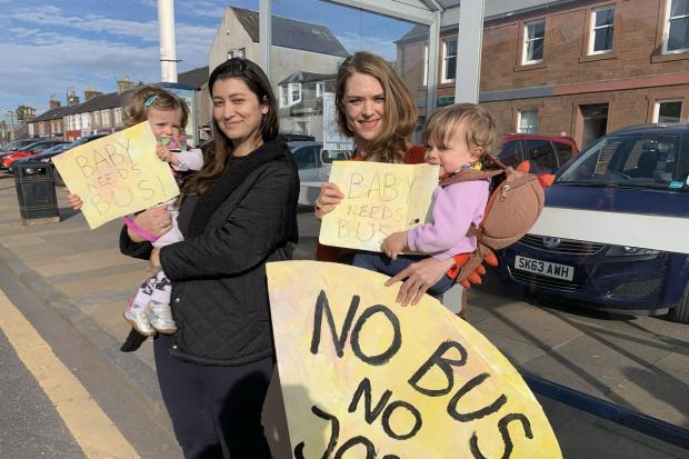 Anna Barbosa and Jennifer Gray, with Nina and Sandy, at a protest earlier this year