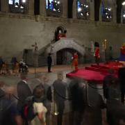 BBC viewers shocked as  royal guard collapses at foot of Queen's coffin.