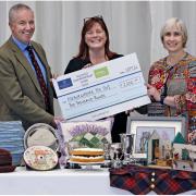 Fallago Environment Fund Chairman, Gareth Baird presents Suzy Finlayson and Kirsty Robb from the Roxburghshire Federation of Scottish Women’s Institutes with a cheque for £2,000.