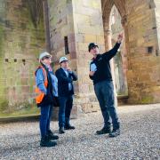 Cllr Jenny Linehan, Craig Hoy MSP and Clive Cruickshank (District Architect at HES) at Melrose Abbey