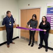 The cutting of the ribbon to unveil the new room. L-R: Ralph Roberts, NHS Borders chief executive, Fiona Lindsay, a parent supported by SiMBA, and Sara Fitzsimmons, founder of the charity and former CEO