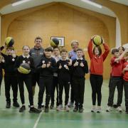 Councillor Carol Hamilton with children at Tweedbank Primary School, Active Schools Basketball session