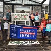 Global Justice Now Scottish Borders Group protesting at SBC HQ on Thursday March 28