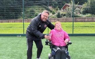 Darren Thomson hands over donation to Graeme McIver on behalf of GFR Para Disability squad
