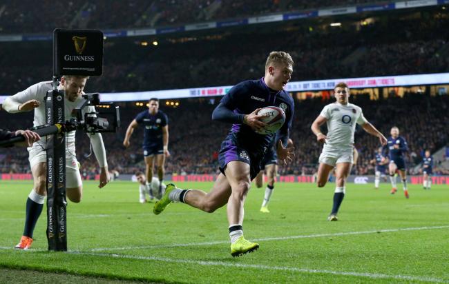 Scotland's Darcy Graham celebrates scores his side's fourth try of the game during the Guinness Six Nations match at Twickenham Stadium, London. PRESS ASSOCIATION Photo.